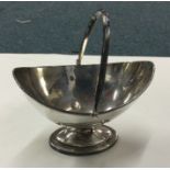 A Georgian silver swing handled basket. London 180