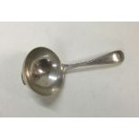 A heavy George III silver caddy spoon. London 1784