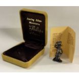 A heavy boxed silver miniature of a cherry girl. A