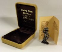 A heavy boxed silver miniature of a cherry girl. A