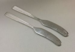 A good pair of Italian silver butter knives. Appro