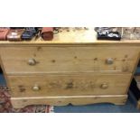 A pine chest of two drawers.