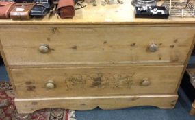 A pine chest of two drawers.