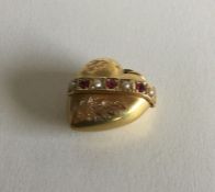 A good Victorian 15 carat gold ruby and pearl hear