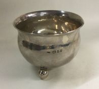 An Arts and Crafts silver bowl on ball feet. Londo