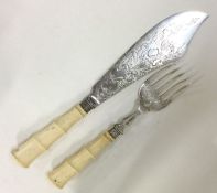 WITHDRAWN: A good pair of Victorian silver aesthetic servers.