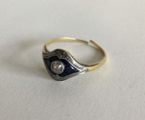 A stylish sapphire and diamond ring with large cen