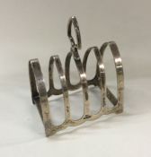 An Edwardian silver toast rack / smartphone dockin