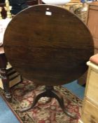 An Antique hinge top table.