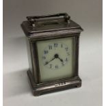An Edwardian silver carriage clock with white enam