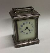 An Edwardian silver carriage clock with white enam