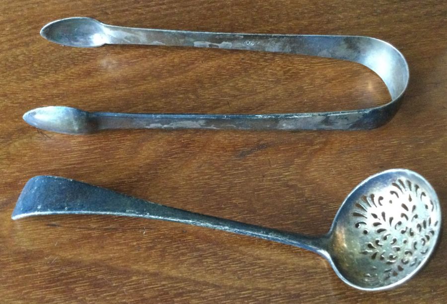 A pair of Georgian silver sugar tongs etc. Approx.