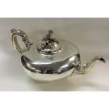 An early Victorian silver teapot with chased acorn