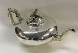 An early Victorian silver teapot with chased acorn