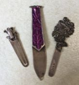 A collection of three silver and other bookmarks.
