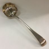 A George III silver soup ladle with crested termin