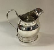 A George III bright cut silver milk jug. London 18
