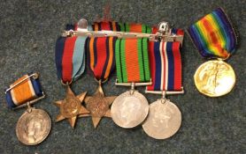 A group of war medals etc.