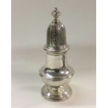 A good quality silver sugar caster. London. By Ric