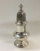 A good quality silver sugar caster. London. By Ric