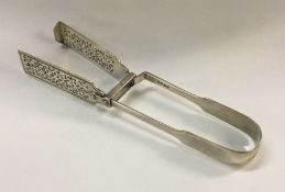 A fine pair of George III silver asparagus tongs.