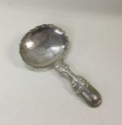 A George III silver caddy spoon. Birmingham 1819.