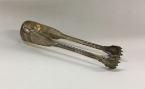 A heavy pair of boxed silver ice tongs. Approx. 82