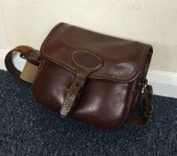 Holland & Holland: A good leather cartridge bag.