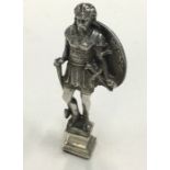 A heavy silver seal in the form of a warrior. Lond