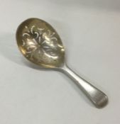 A George III pierced silver caddy spoon. London 18