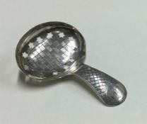 A good Georgian silver bright cut caddy spoon. Lon