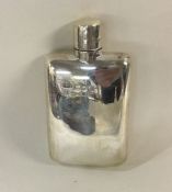 A silver flask with screw-on lid. London 1909. By