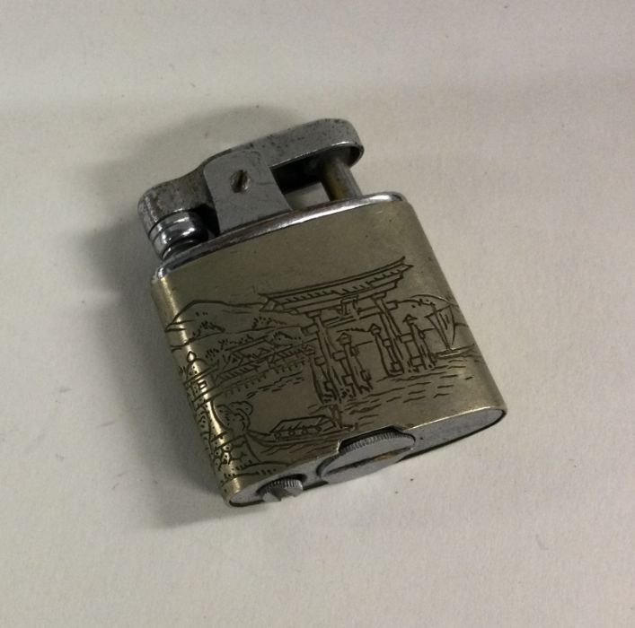 A Japanese Sterling silver lighter. Approx. 33 gra