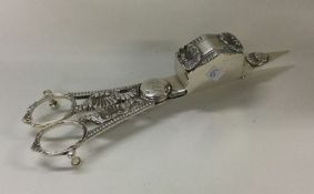 A heavy pair of George III silver candle snuffers.