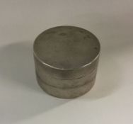 A heavy engine turned cylindrical silver box with