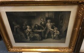 A large gilt framed print.