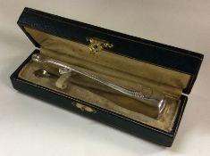 A pair of cased silver sugar tongs. Possibly Frenc