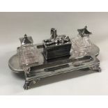 A rare silver mounted glass inkstand depicting an