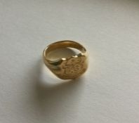 A good 18 carat crested signet ring of shaped form