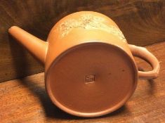 A Chinese terracotta teapot. Marked to base.