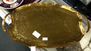 A large Arts and Crafts oval brass tray.
