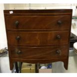 A bow front mahogany apprentice chest.
