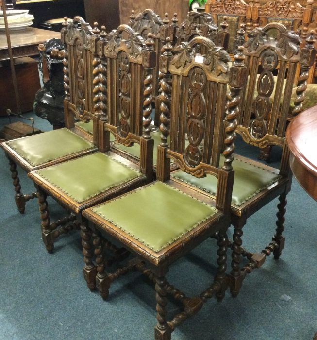 A set of six oak carved chairs.