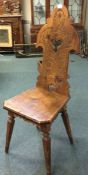 An old stripped pine hall chair.
