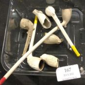 A group of old clay pipes.