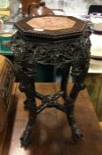 A good Chinese hard wood table with marble inset.