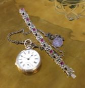 A silver pocket watch on chain together with a bra