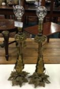 A pair of brass mounted candlesticks.