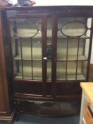 A mahogany display cabinet.