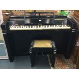 A stylish upright piano together with matching sta
